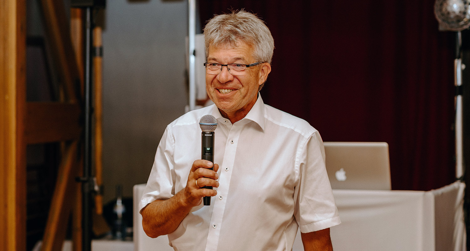 Wilhelm Ulrich speaking with a microphone