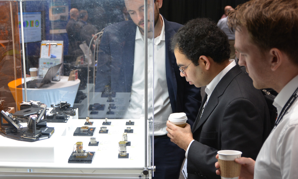 Attendees viewing new products at SPIE Advanced Lithography + Patterning Exhibition