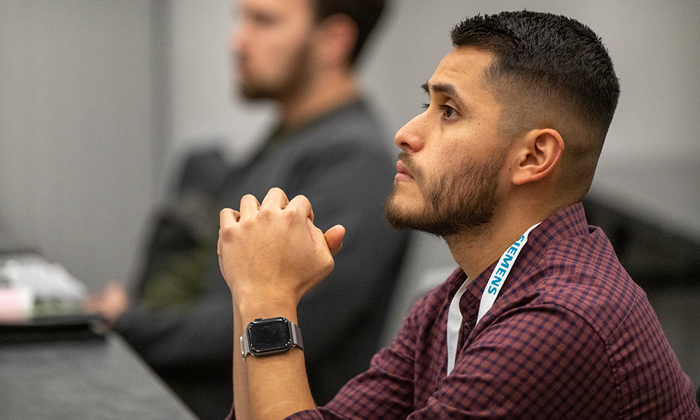 Attendee listens to an instructor during a training course