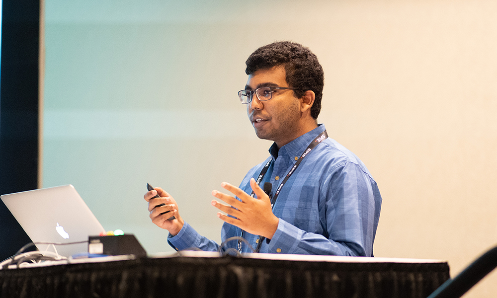 An author preparing a video presentation at SPIE Optics + Optoelectronics