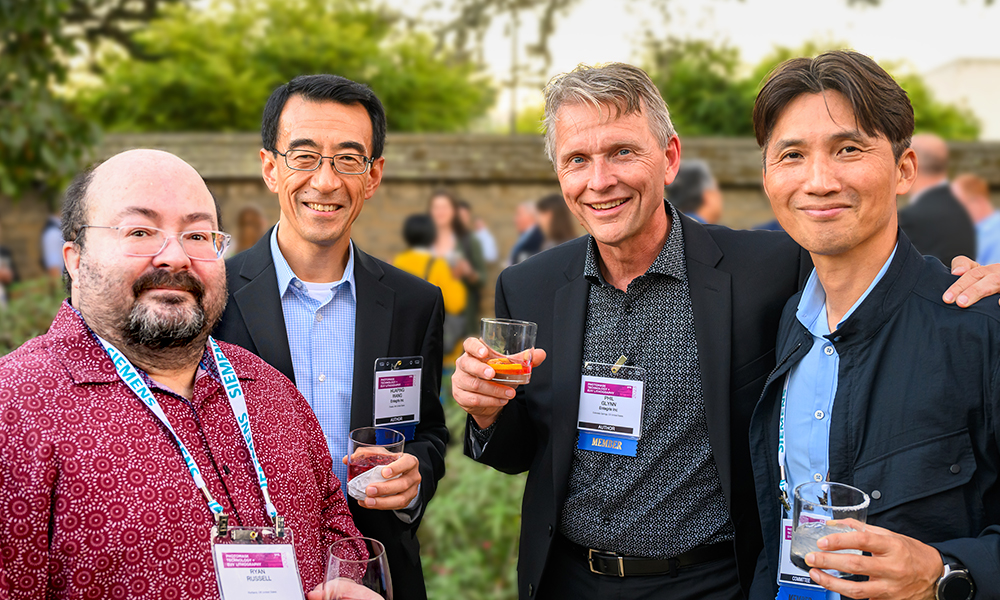 Colleagues gather with food and drink at SPIE Photomask Technology + EUV Lithography