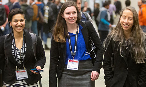 Smiling attendees at an SPIE event