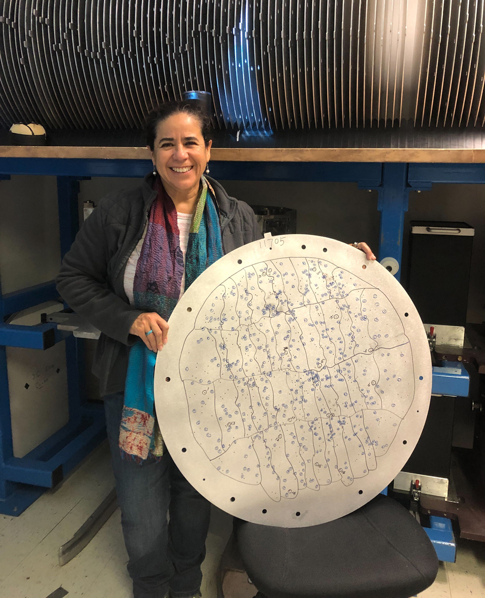 Solange Ramirez holding one of the traditional Sloan aluminum plates