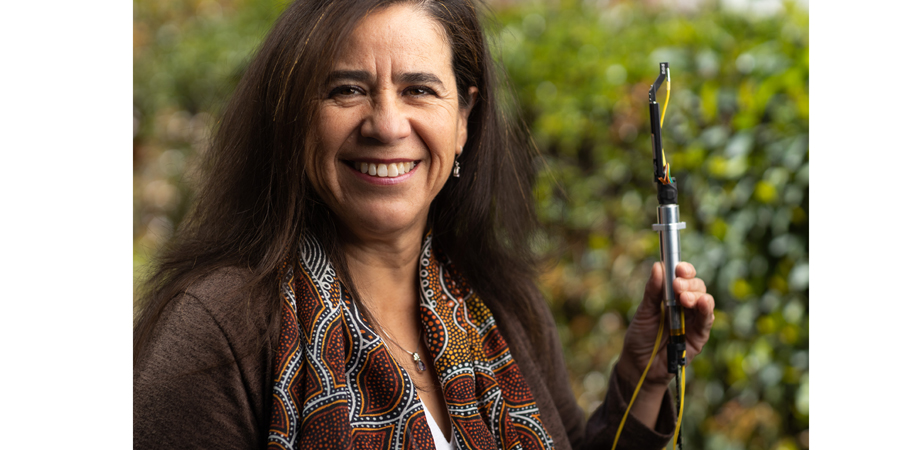 Solange Ramirez holds one of the fiber positioners for the SSDS-V