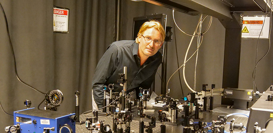 Andrea Alù in the optical laboratory at City University of New York