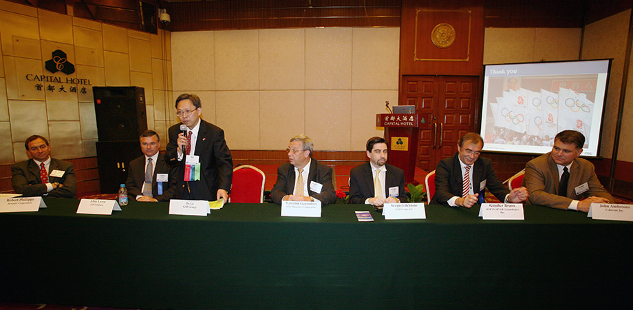 Panel discussion at PICALO 2008 in Beijing. Bo Gu, standing, chaired the business executive forum of the conference. From left to right: Robert Phillippy, President of Newport Corporation; Alan Lowe, President of JDS Uniphase; Valentin Gapontsev, CEO of IPG Photonics; Sergio Edelstein, CEO of GSI Group; Gunther Braiun, CEO of Rofin-Sinar Technologies; John Ambroseo, CEO of Coherent.