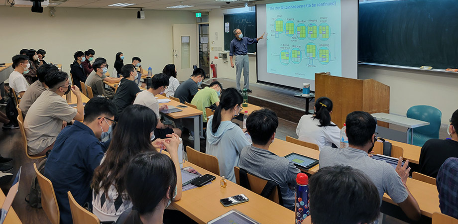 Burn Lin teaching in a classroom.