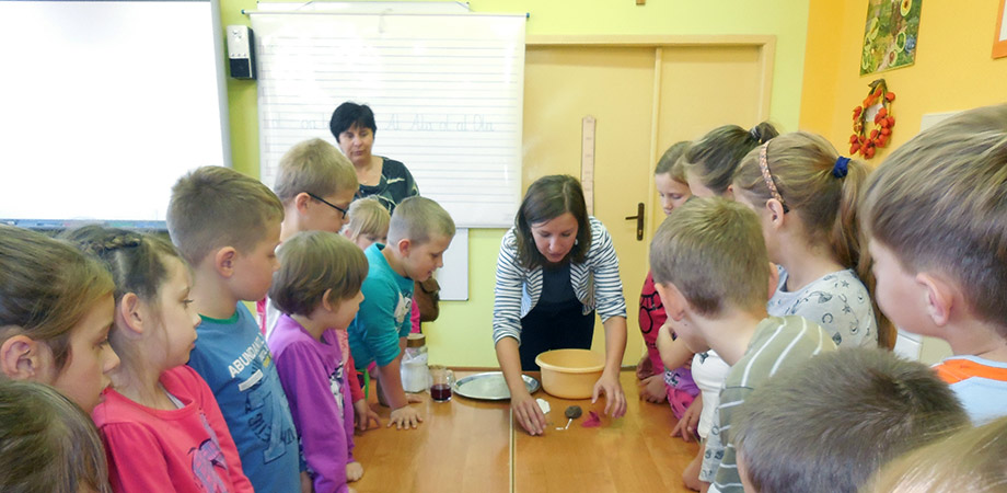 Danuta Sampson in a classroom with children.