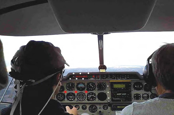 Pilot wears fNIRS device during flight